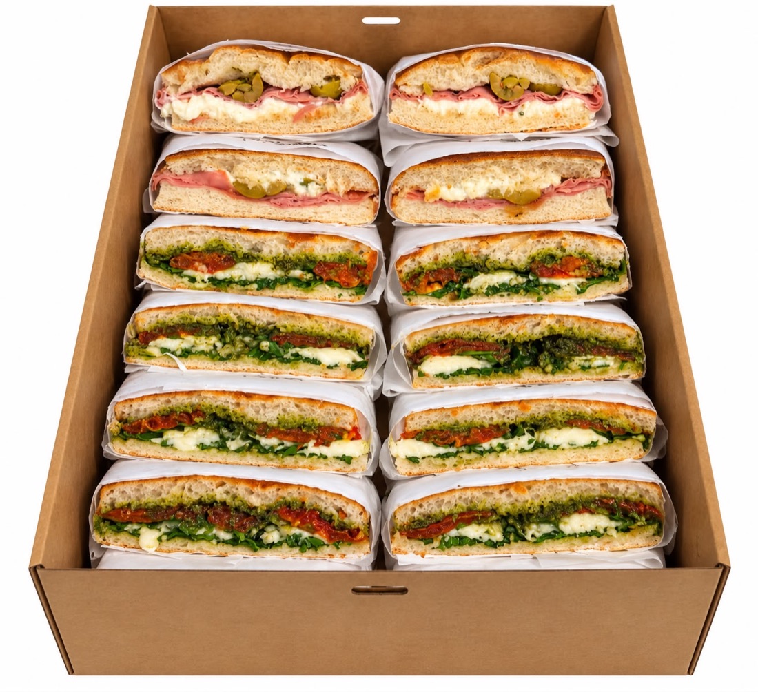 Box of halved schiacciata sandwiches for an office lunch